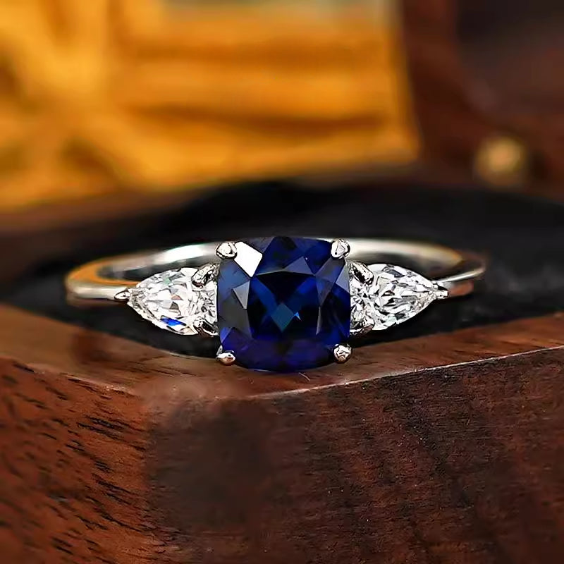 Three Stone Blue Cushion Cut Sterling Silver Ring