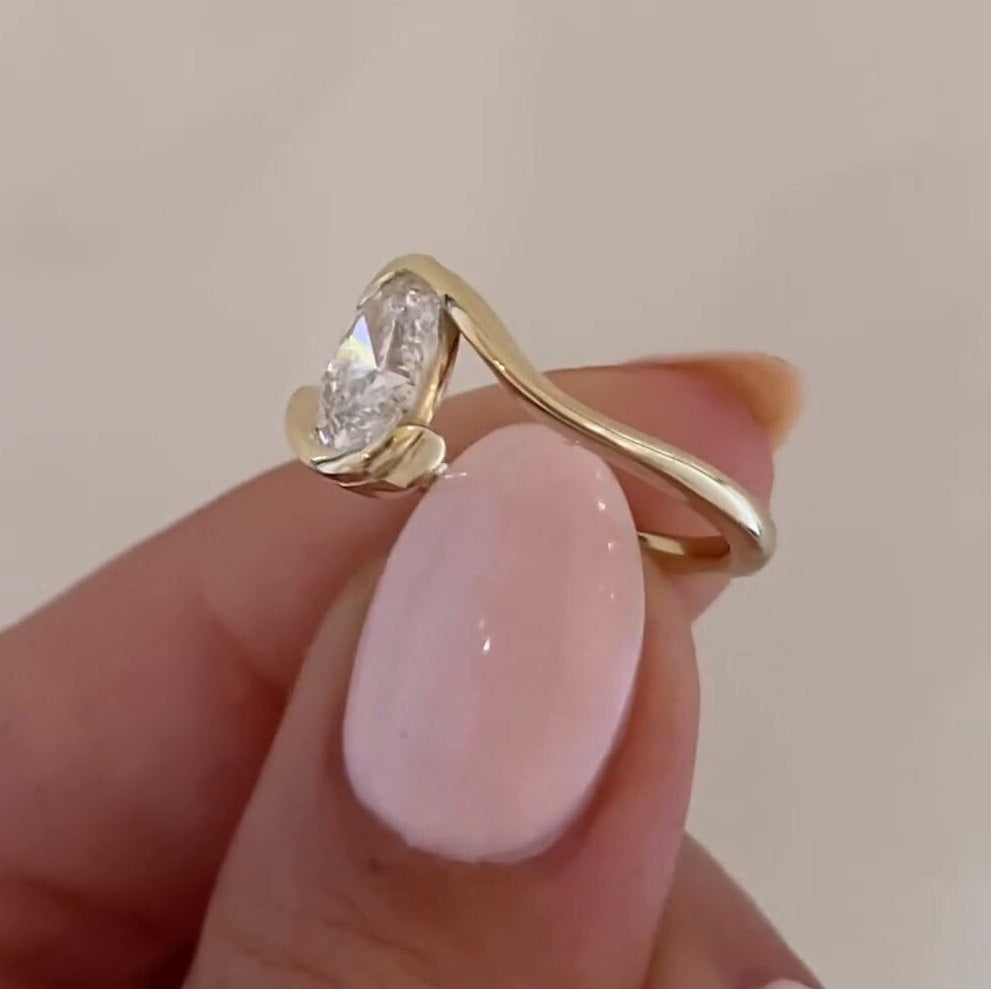 Oval Cut Bypass Solitaire Engagement Ring in Sterling Silver