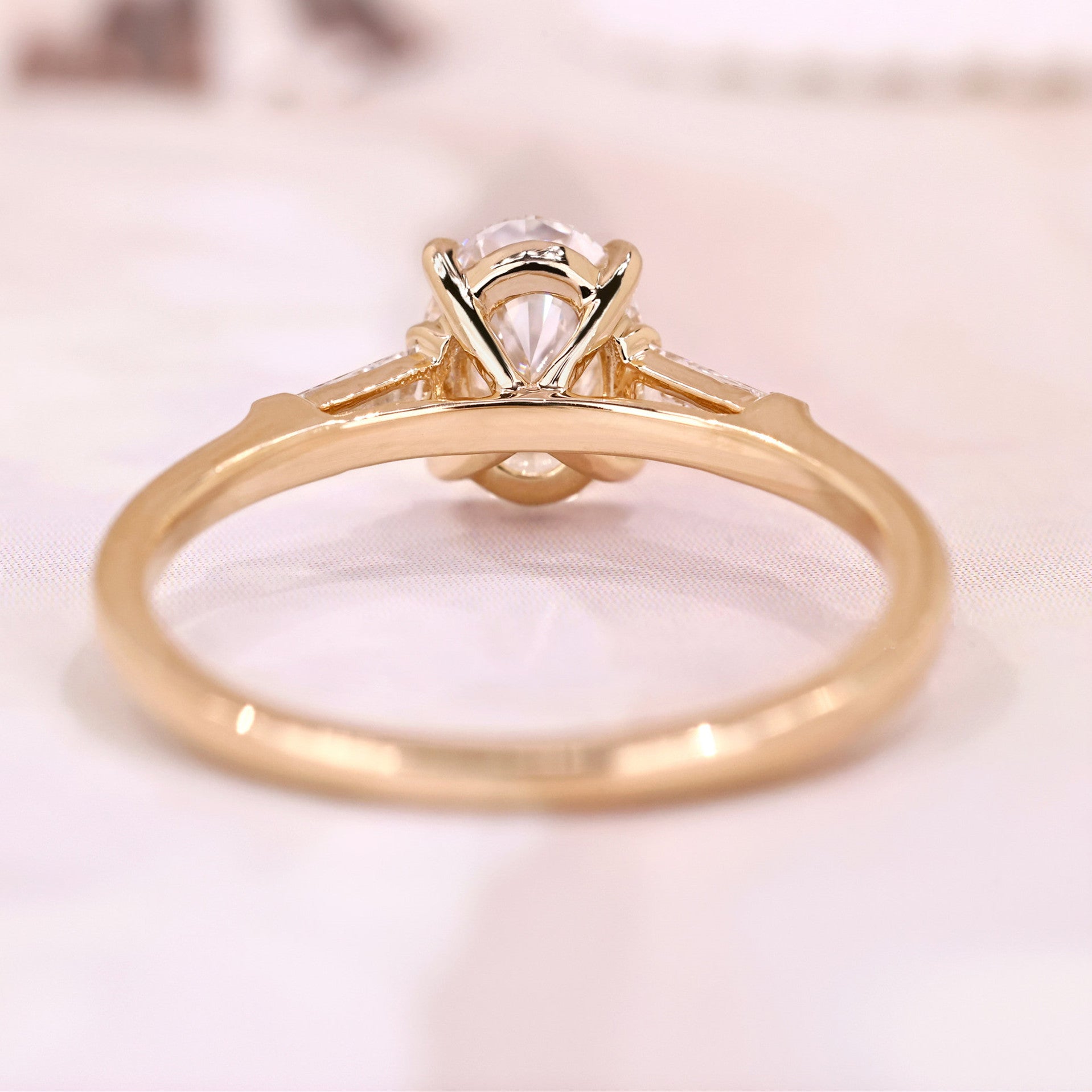 Three Stone Oval Cut with Side Tapered Baguette Cut Engagement Ring