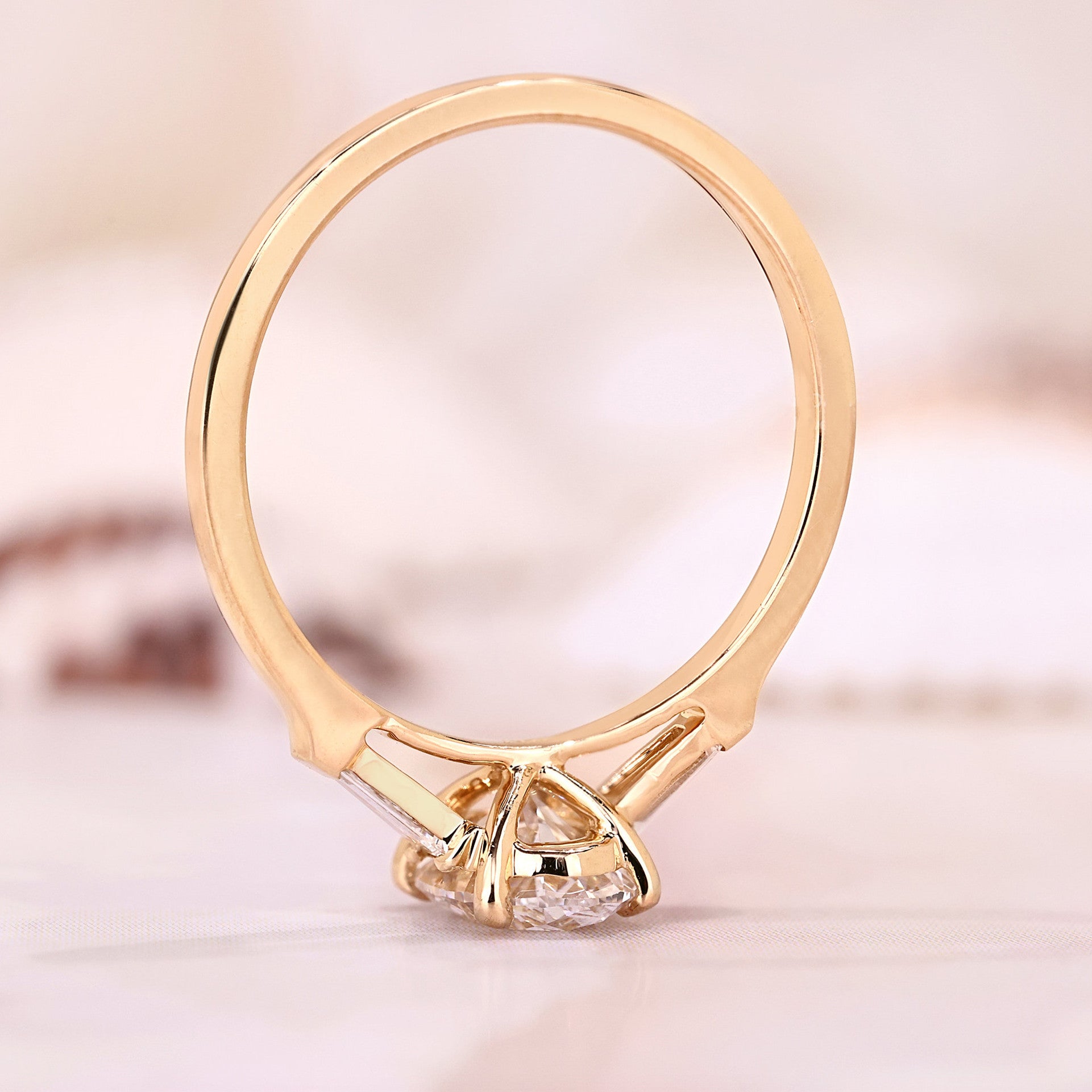 Three Stone Oval Cut with Side Tapered Baguette Cut Engagement Ring