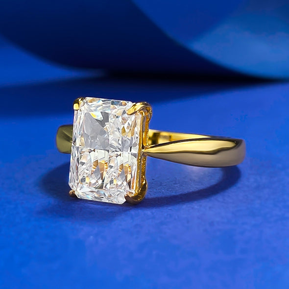 Gleaming Sterling Silver Engagement Ring in Radiant Cut and Golden Tone