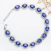 Oval Cut Sapphire Tennis Bracelet in Sterling Silver