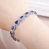 Oval Cut Sapphire Tennis Bracelet in Sterling Silver