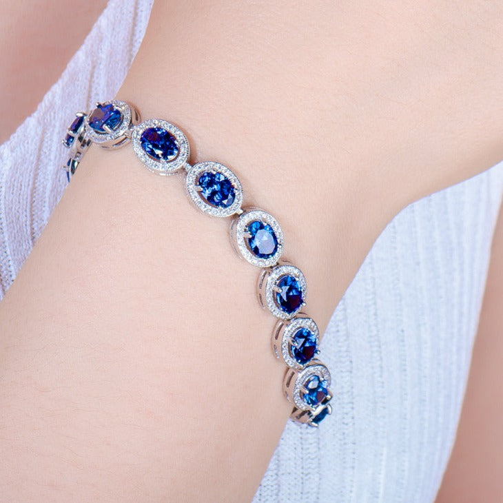 Oval Cut Sapphire Tennis Bracelet in Sterling Silver