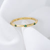 Stylish Golden Tone Wedding Band with Gemstone Accents