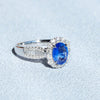 Halo Oval Cut Blue Sapphire Engagement Ring in Sterling Silver